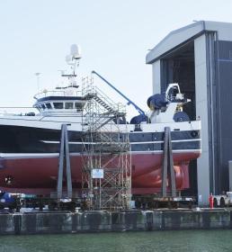 A large boat in a shipyard