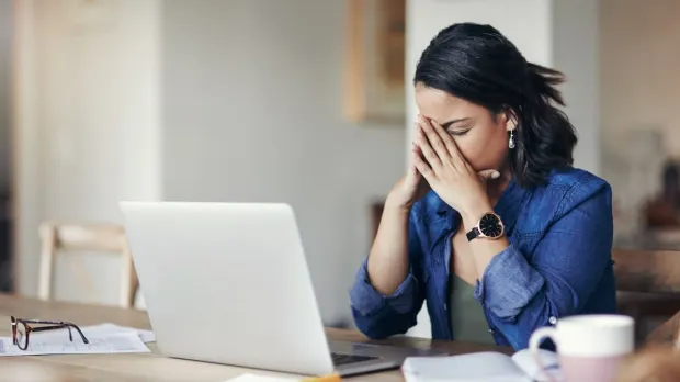 Errors and omissions Stressed lady after making error in business