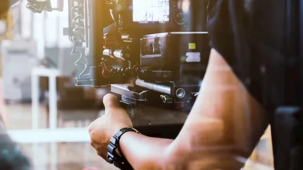 A cameraman operating his camera
