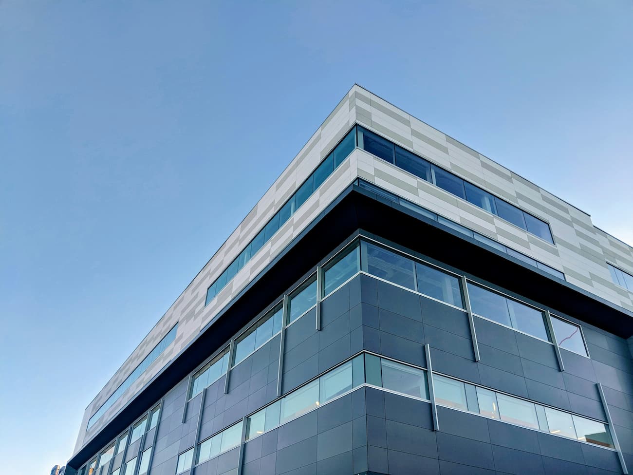 Grey building under a blue sky