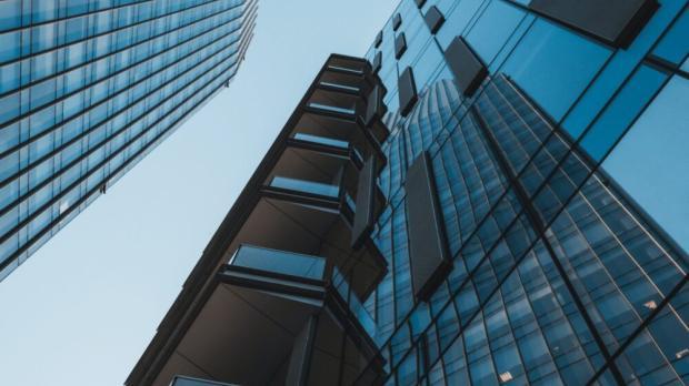 talk office with glass windows reflecting the opposite building
