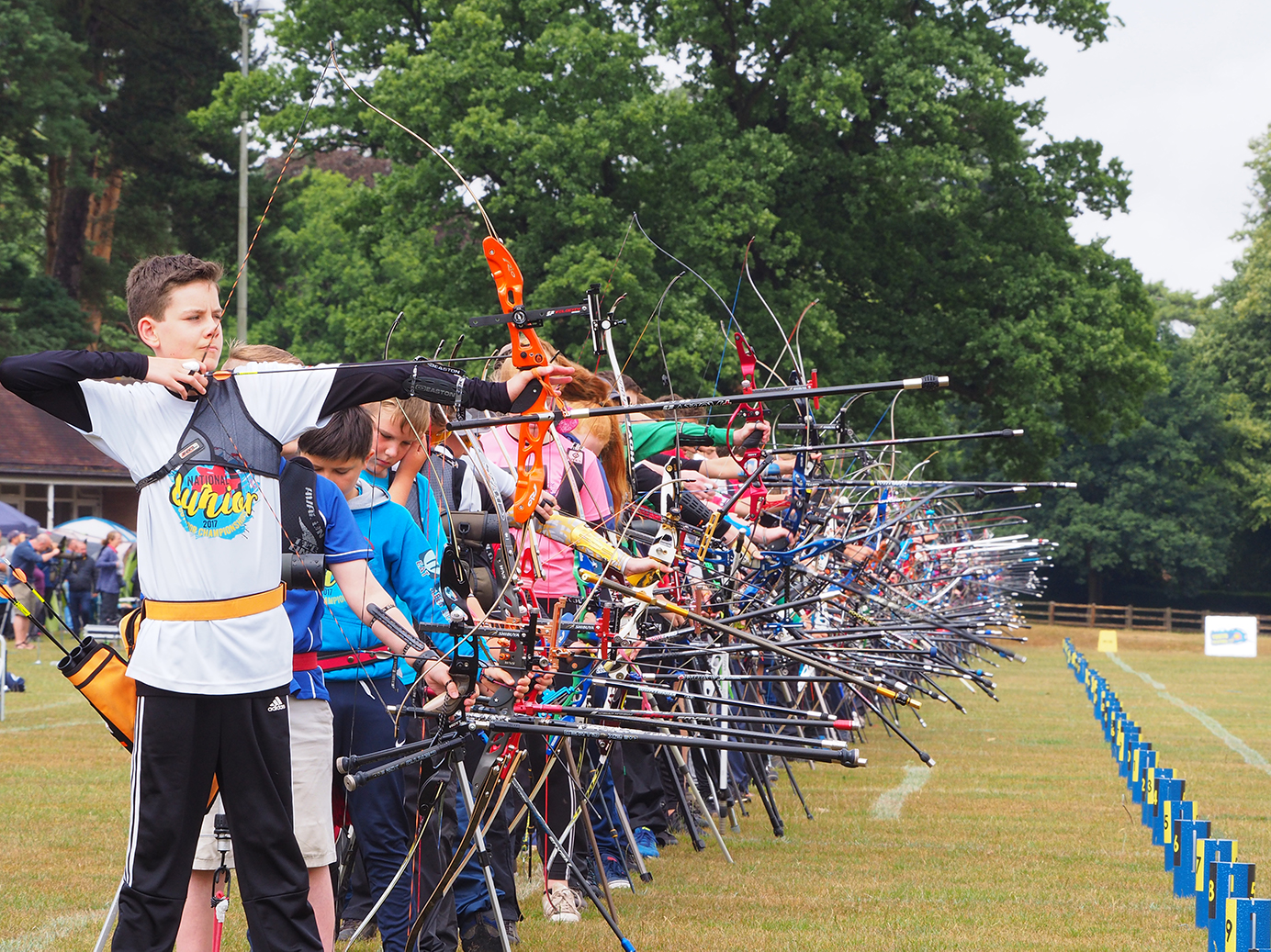 Archery club firing arrows