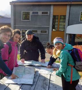 Mountaineering group meeting at a hut