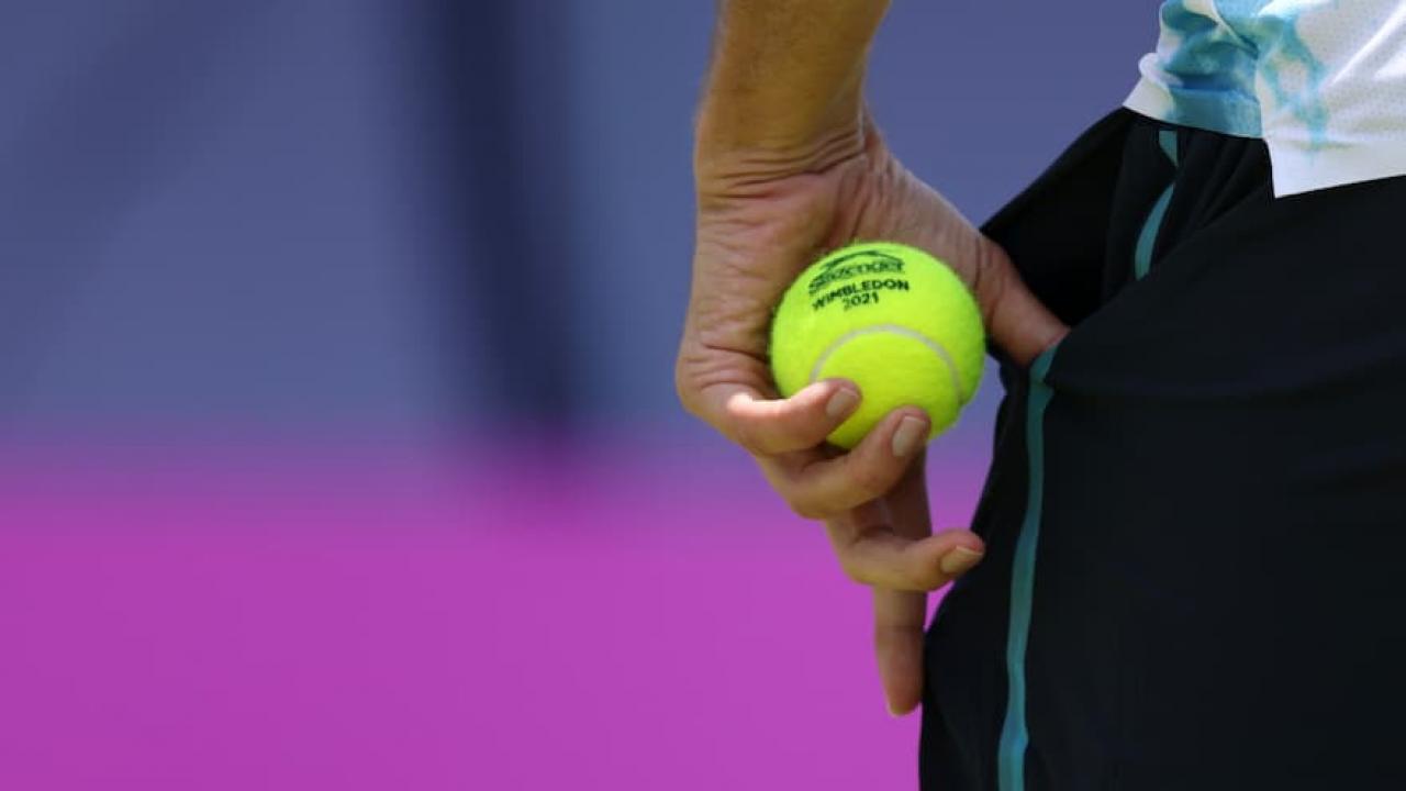 Tennis ball going in pocket