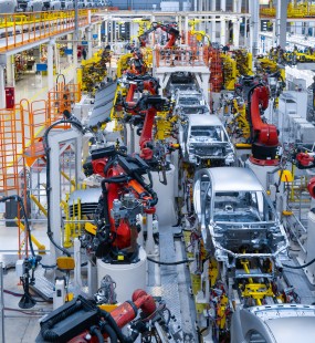 Partially-built cars on an automated production line