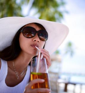 A woman relaxing at restaurant in a beach resort