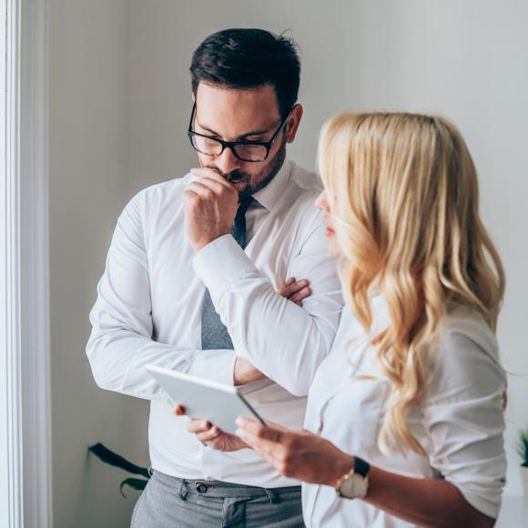 Woman and man consulting over business decision 