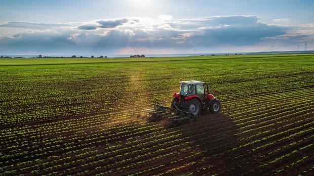Tractor working on field