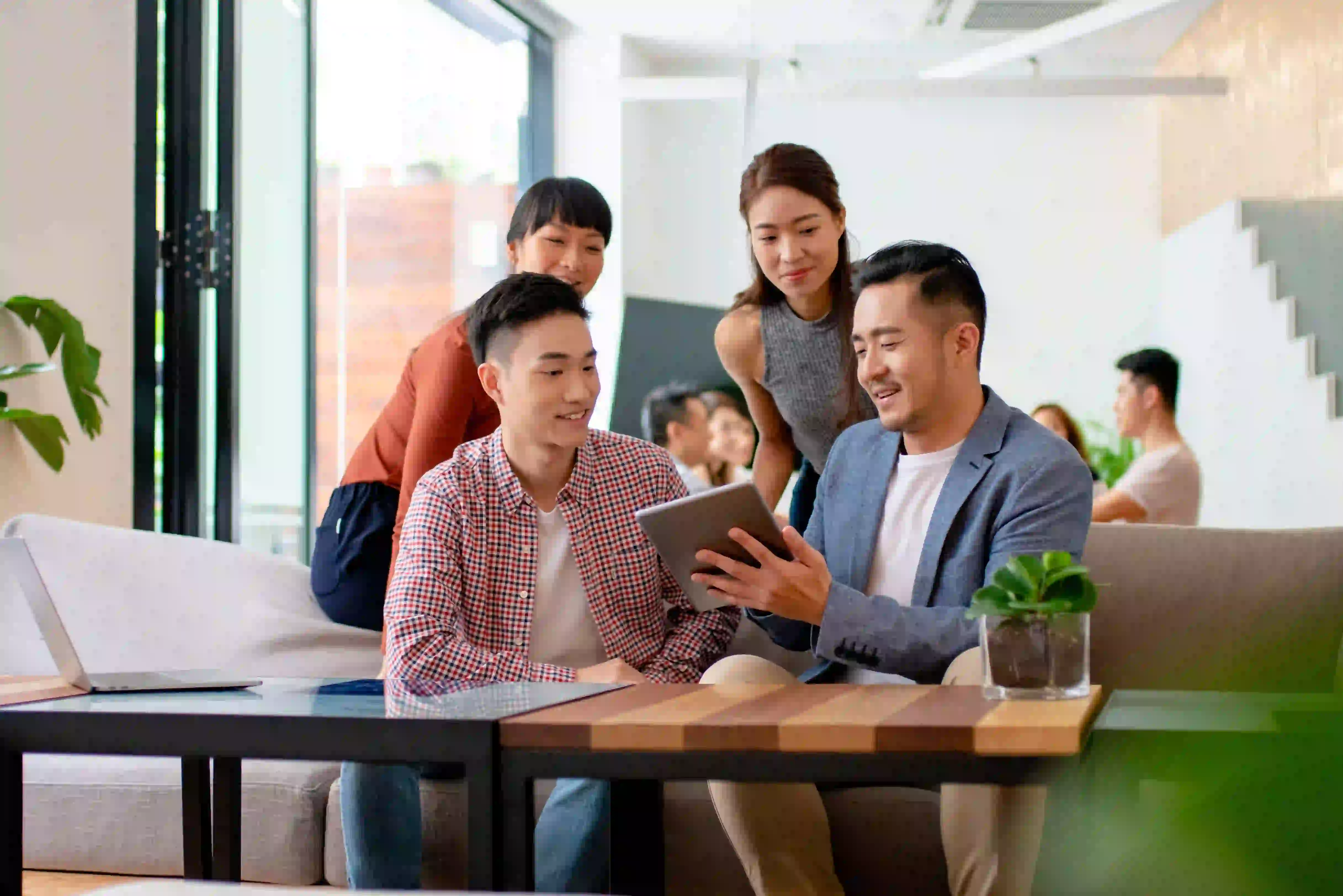 Colleagues collaborating in a relaxed modern workspace
