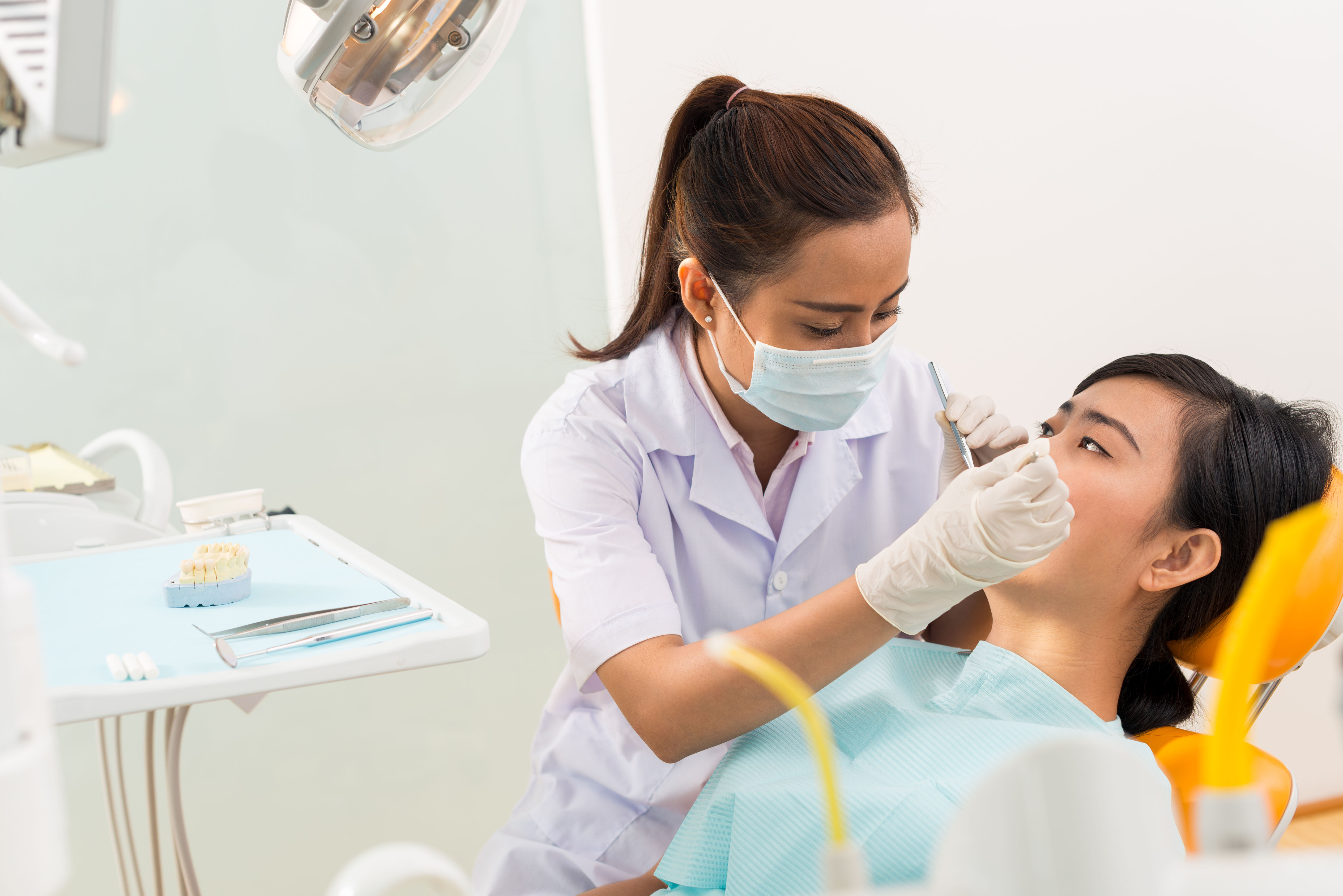 female colleague in dentist chair