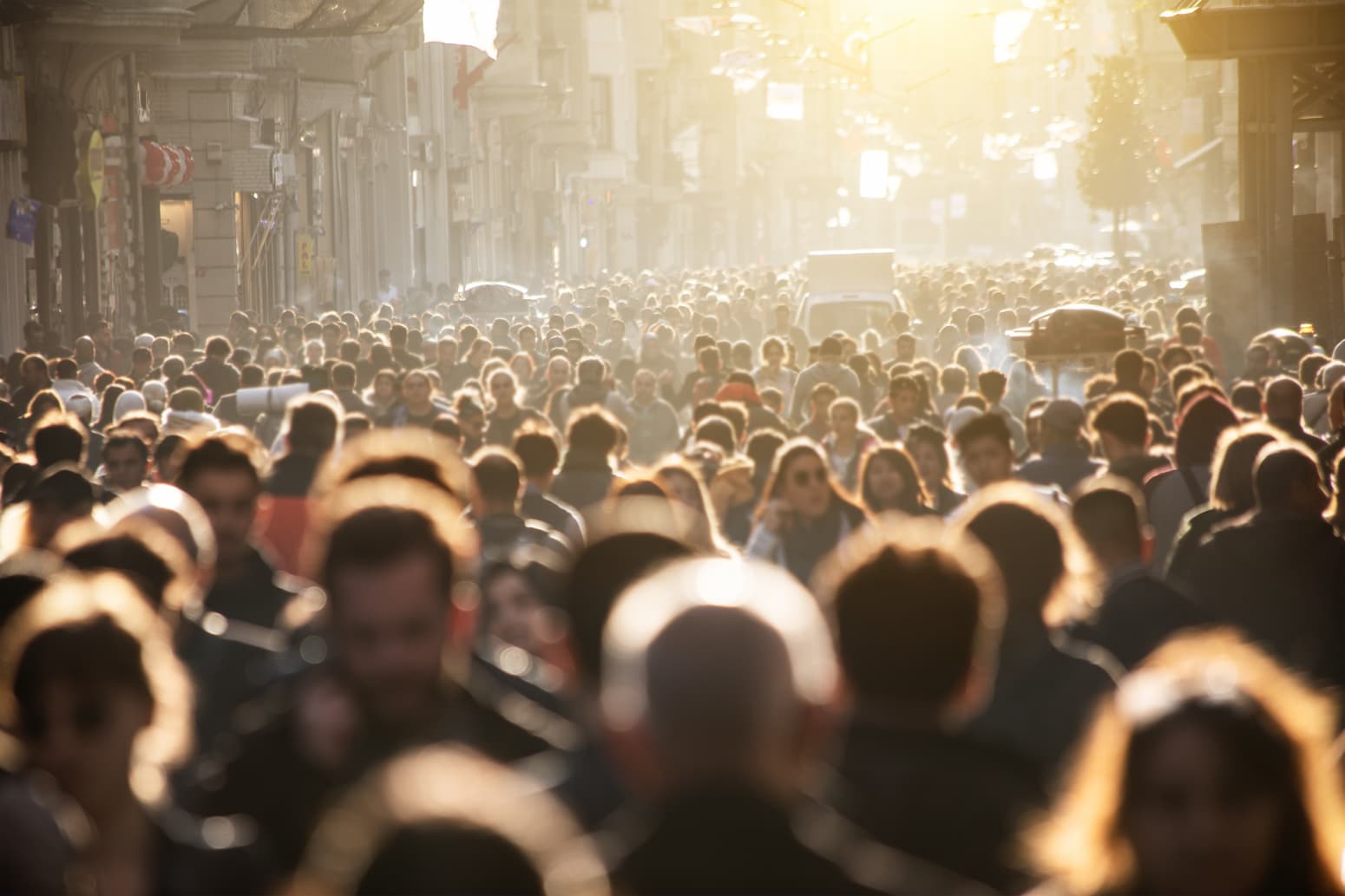 Hundreds of people walk in a crowded street in Thailand