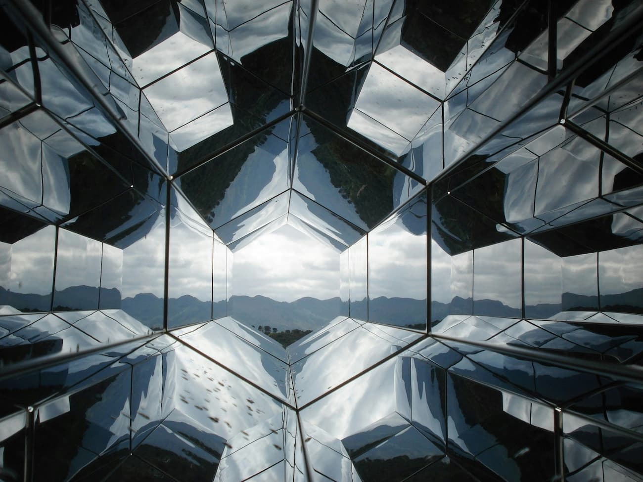Glass building with mountains