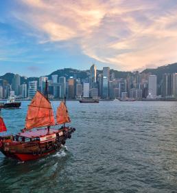 Traditional junk boat sailing across Victoria Harbour