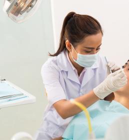 female colleague in dentist chair