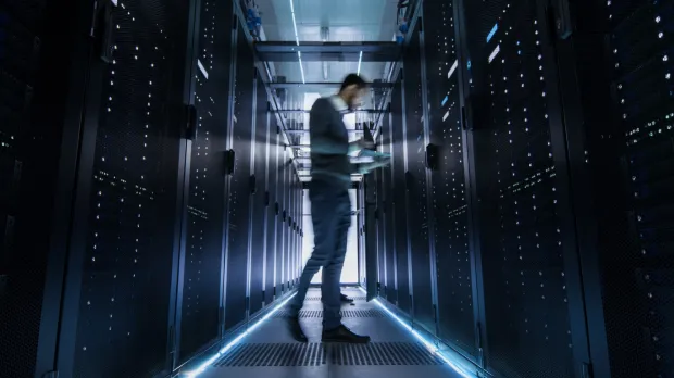 IT engineer examining server racks