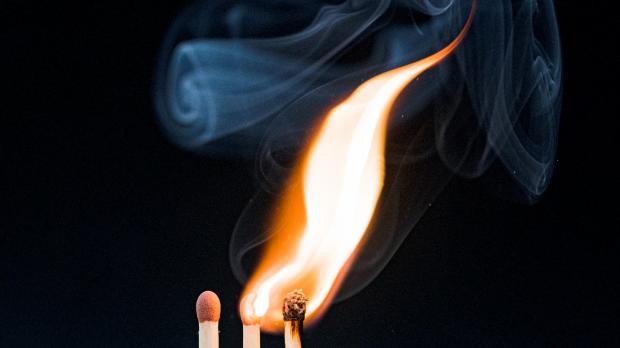 Three matches, with two alight and one unlit