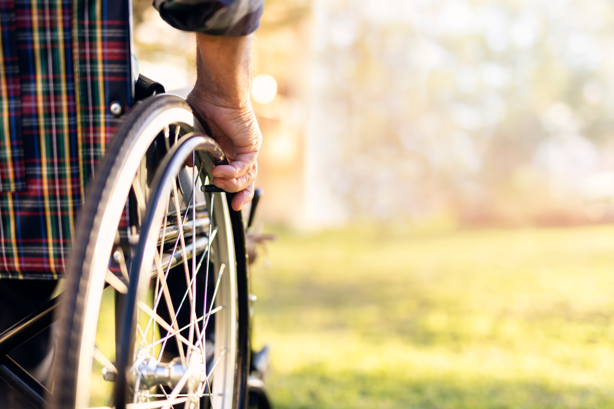 wheelchair user in park - critical illness