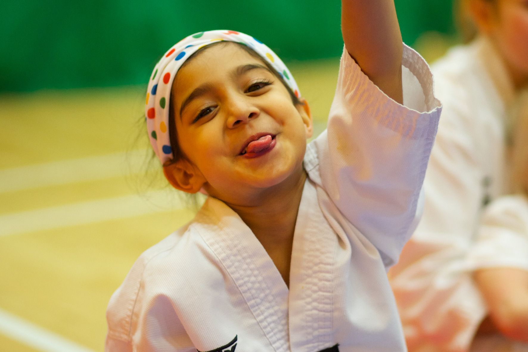 Happy young girl in Taekwondo gear