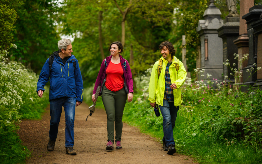 Group of three ramblers in cemetery