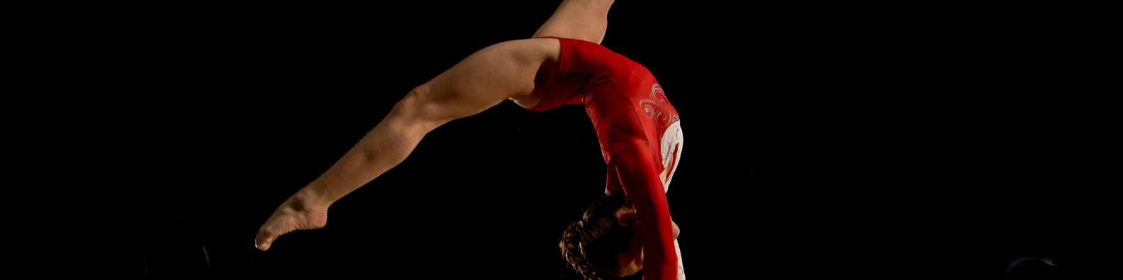 Female gymnast on a beam