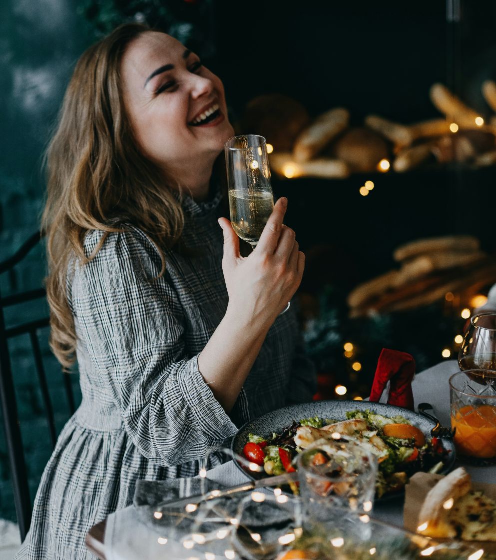 woman celebrates at Christmas party