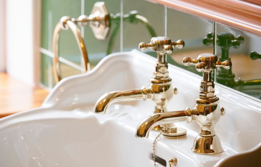 brass taps over sink