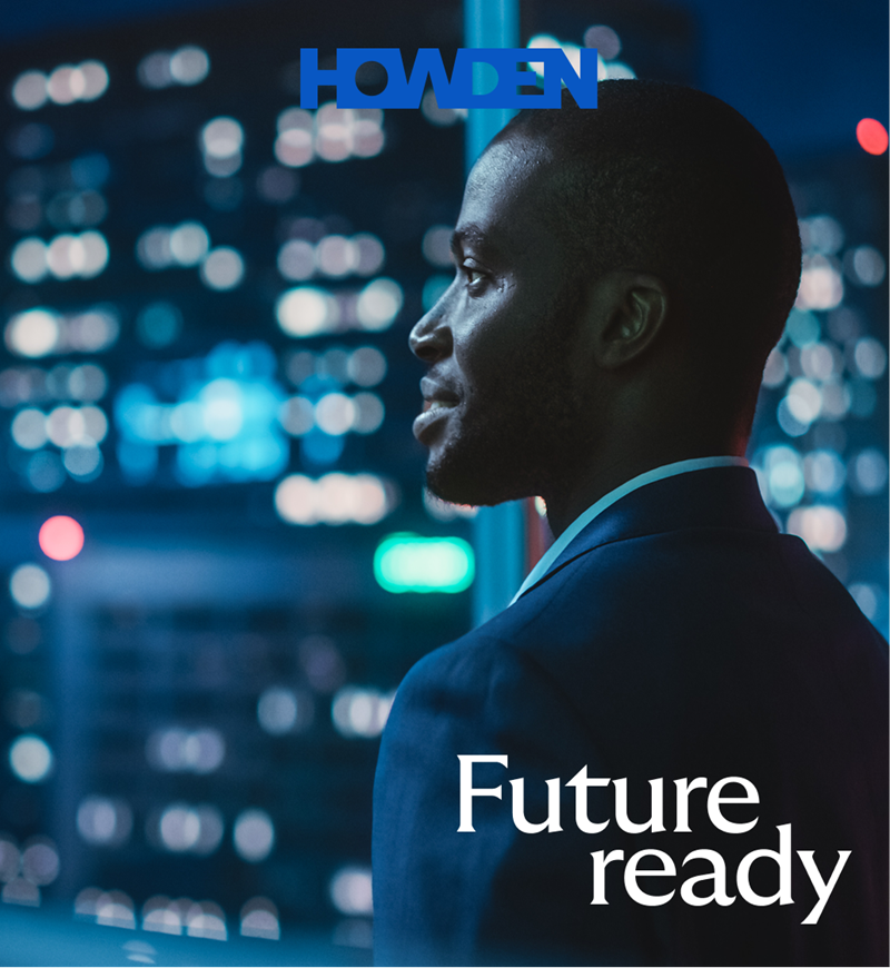 A man in a suit looks out a window at city lights at night, with “HOWDEN” and “Future ready” text overlayed.
