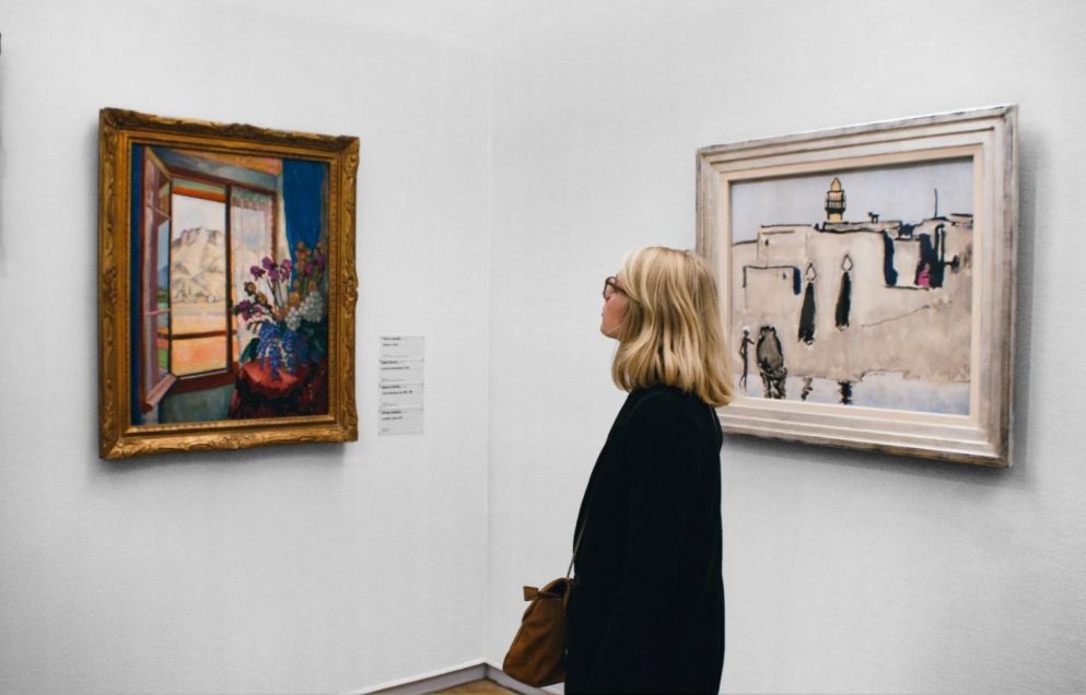 woman observing painting