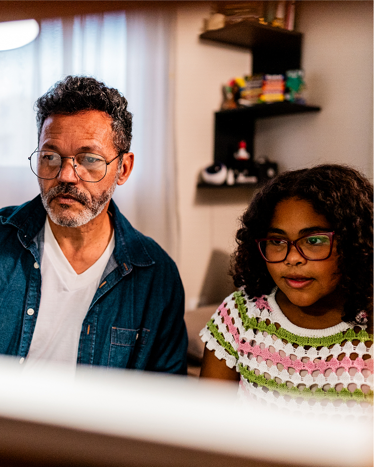 Father and daughter on a computer
