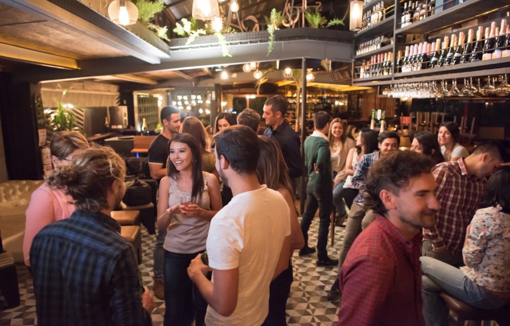 people socialising in a bar