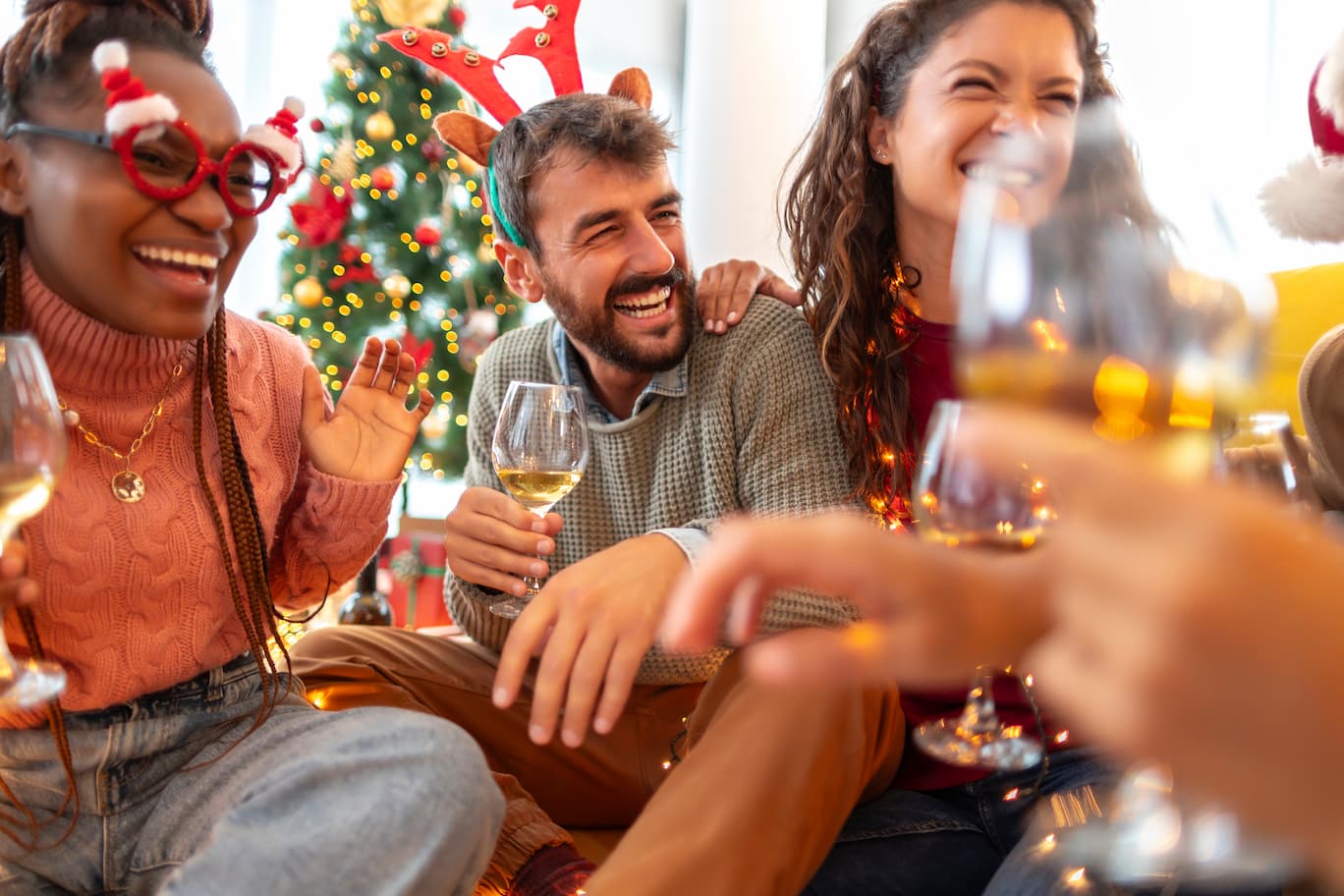 A group of people enjoying a work Christmas Party