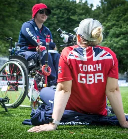 ArcheryGB coach sitting on field 