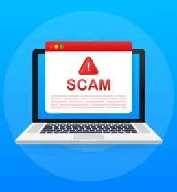 Laptop with Scam warning sign