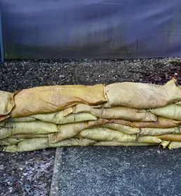 Sandbags laid by external wall as flood defence