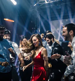 People dancing under disco lights