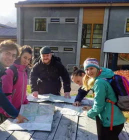 Mountaineering group meeting at a hut