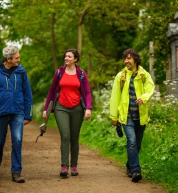 Group of three ramblers in cemetery