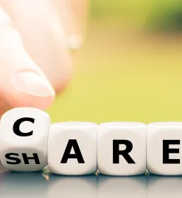 Dice form the words "care" and "share"