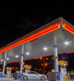 A petrol station forecourt at night