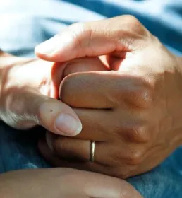holding hands caring for someone
