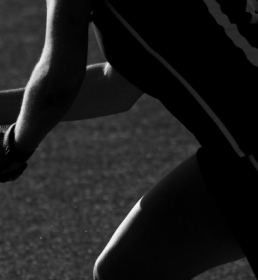 Female hockey player with raised hockey stick