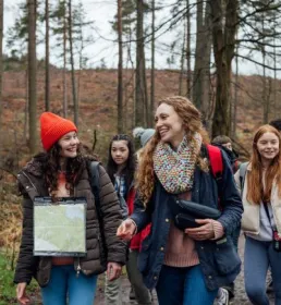 School group walking in woods