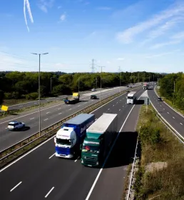 lorries drive along a motorway