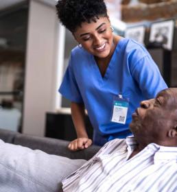 life nurse speaking with older patient