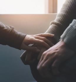 person comforting another