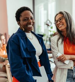 2 ladies at work smiling