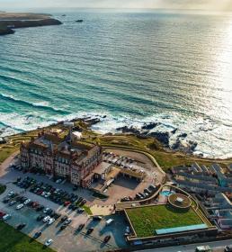 Aerial view of a coastal resort with waves crashing on the shore