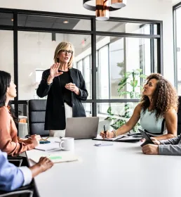 key people gathered around a business meeting table