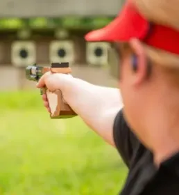 person firing at a target