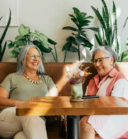 Two mature ladies having coffee